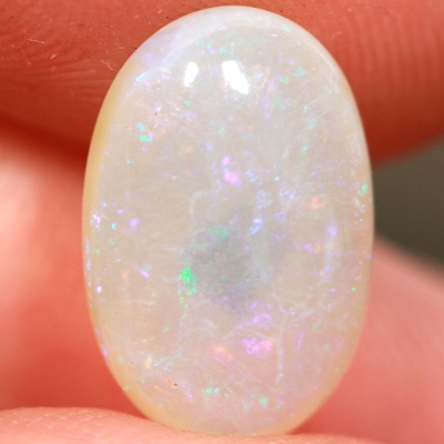SOLID CRYSTAL OPAL Pinfires of pinks and greens throughout